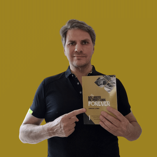 Image of Simon holding Automated Property Leads Forever and pointing at the book.