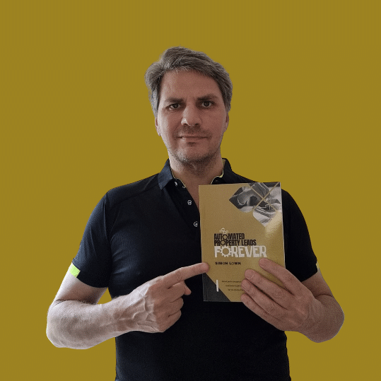 Simon holding a copy of Automated Property Leads Forever pointing at the title.