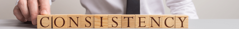 Consistency spelt out in wooden blocks