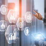 Various holographic representations of Sales, ROI and target info with a guy holding a futuristic pad about to presss one.