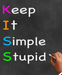 KISS acronym being chalked onto a blackboard.
