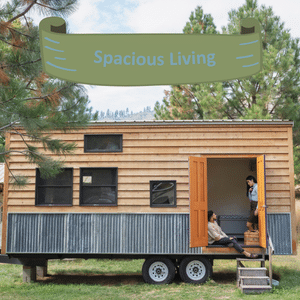 A mobile horse box converted into a living space with a banner above saying "Spacious Living".