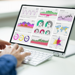 A very smart analytics dashboard shown on a white laptop.