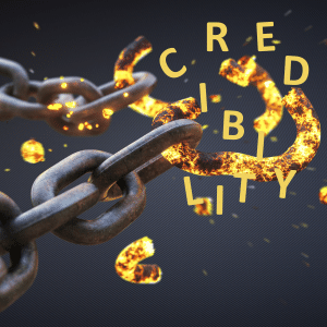 The word 'credibility' broken over and image of two links shattering in a chain.