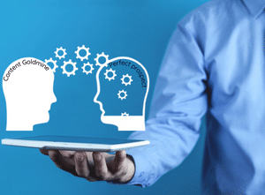 Man holding a tablet with two graphic heads hovering above. The left head is full of knowledge about your content goldmine and is transferring (represented by cogs) to the empty perfect prospects head.

Represents: Sharing your knowledge is a cornerstone of a content goldmine.