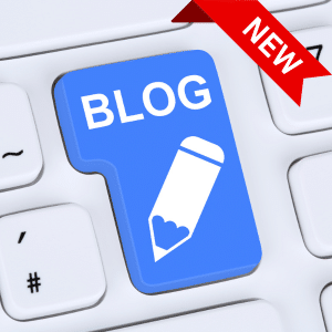 An oversize blue button labelled blog on a white keyboard with a "new" banner overlaying the top right hand corner.