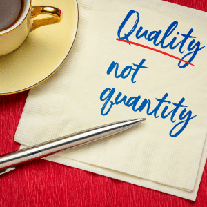 Quality (underlined) not quantity written on a napkin.