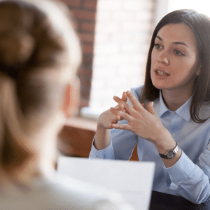Property expert speaking to a prospect in her office.