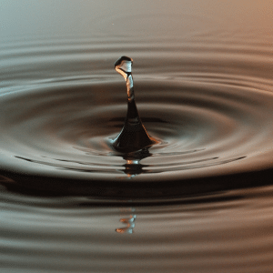 A drop of water showing the ripple effect.